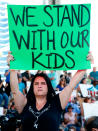 <p>Protesters hold signs at a rally for gun control at the Broward County Federal Courthouse in Fort Lauderdale, Fla., on Feb. 17, 2018. (Photo: Rhona Wise/AFP/Getty Images) </p>