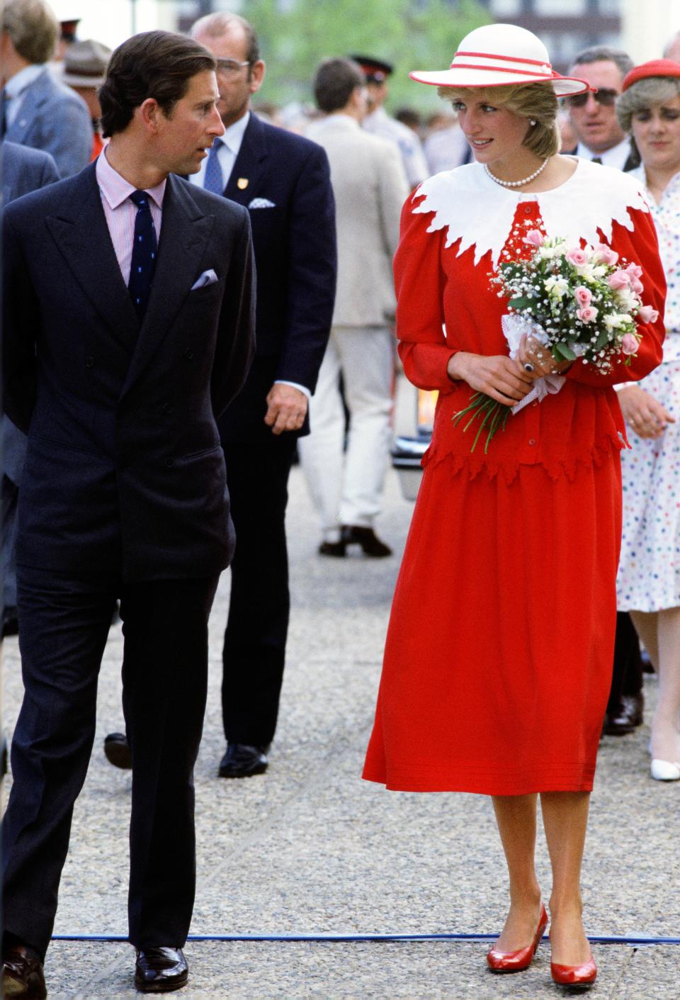 Kate Middleton wore a red Jenny Packham dress for her newborn baby's debut—and it's two nods in one to the late Princess Diana. See the full look here.