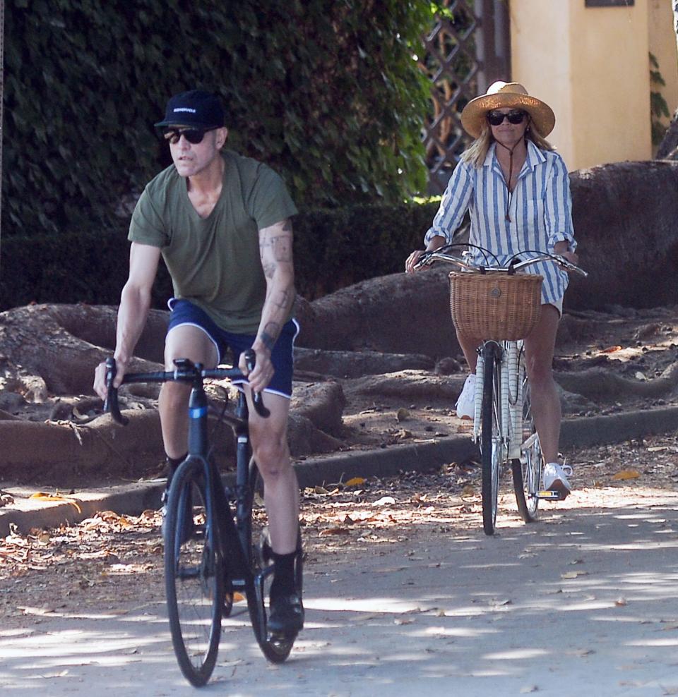 <p>Jim Toth leads the way for a Father's Day bike ride with Reese Witherspoon on Sunday in L.A.</p>