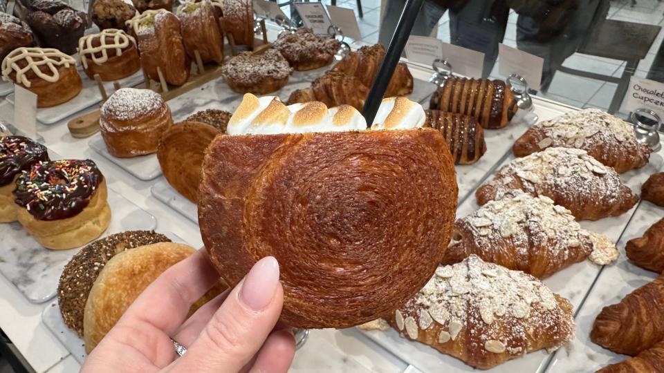 Hot chocolate is served in a soft, warm croissant and torched Italian meringue delicately piped on top to resemble fluffy marshmallows at Bella's Bake Shop in Mount Kisco.