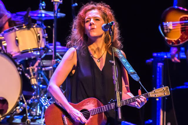 <p>Robin Little/Redferns/Getty</p> Neko Case performing onstage in London, England on November 8, 2018