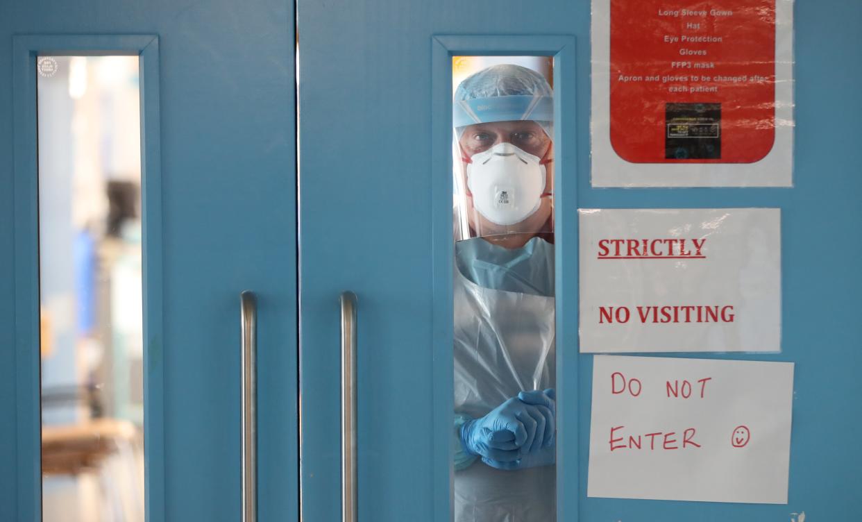 Infection control nurse Colin Clarke looking out from a Covid-19 recovery ward at Craigavon Area Hospital in Co Armagh (PA) (PA Wire)