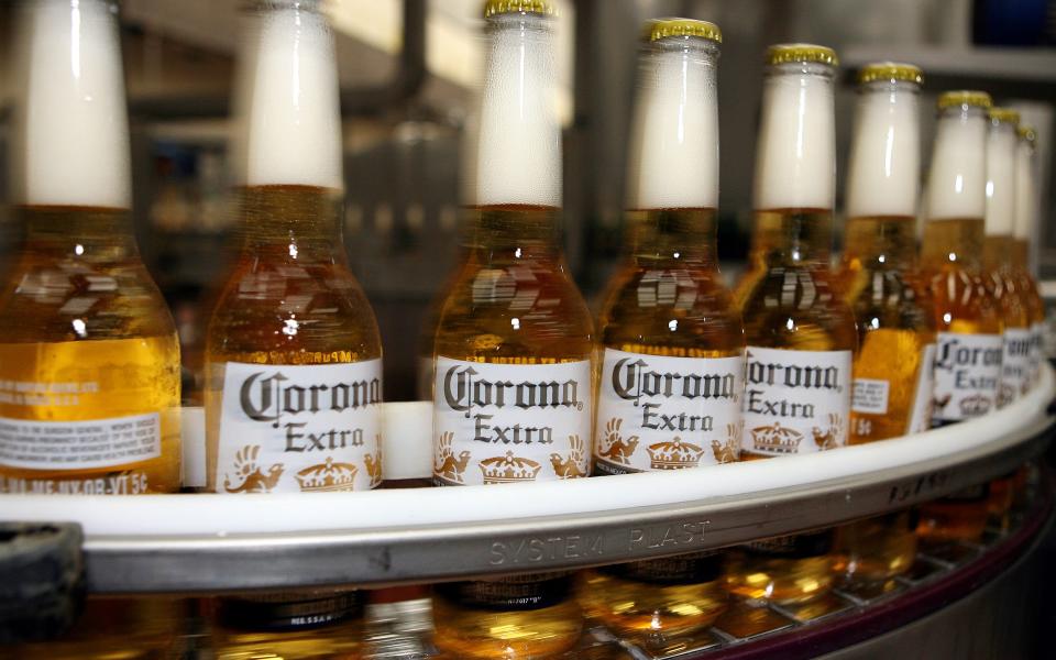 AB InBev, producers of Corona beer, says the outbreak has affected sales in China and will cut first-quarter profits by a tenth -  SUSANA GONZALEZ