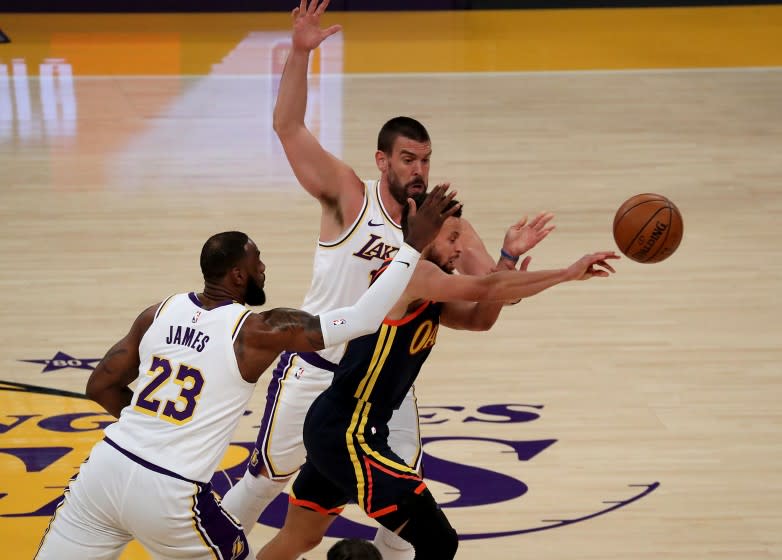 Lakers LeBron James and Marc Gasol try to trap Warriors guard Stephen Curry durng a game in February.