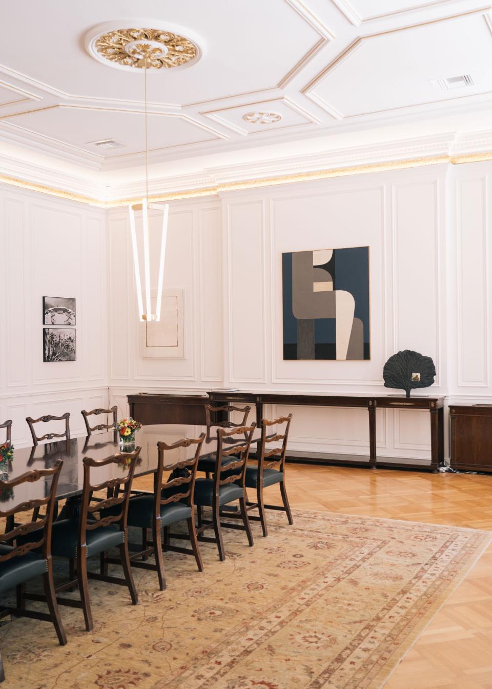 One end of the meeting room is anchored by Full Moon TH, an acrylic-on-canvas painting by famed midcentury painter Yiannis Moralis. Eleni Vernardaki’s earthenware Burnt Trees sculpture stands on the console, and two photographs by Nelly’s (a.k.a. Elli Seraidari), one of Greece’s first famous female photographers, hang on the opposite wall.