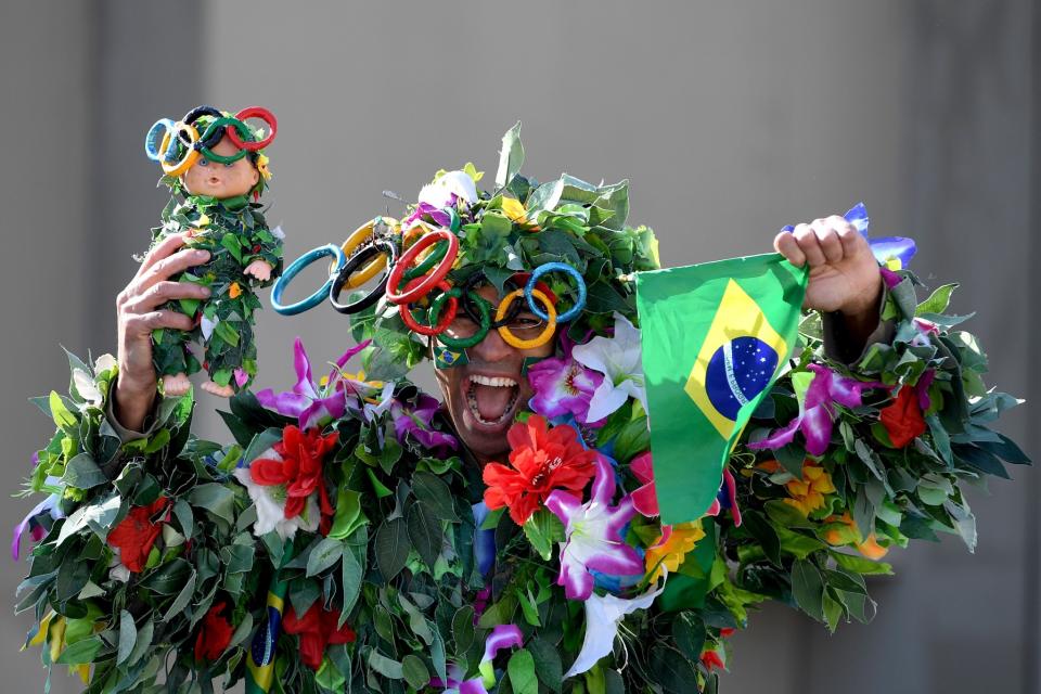<p>A Brazilian fan cheers before the start of the Women’s Marathon on Day 9 of the Rio 2016 Olympic Games at the Sambodromo on August 14, 2016 in Rio de Janeiro, Brazil. (Photo by David Ramos/Getty Images) </p>