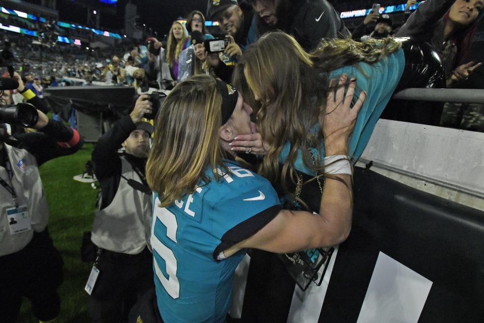 Jacksonville Jaguars quarterback Trevor Lawrence (16) gets a kiss from his wife Marissa from the stands after Saturday night's victory over the Tennessee Titans. The Jacksonville Jaguars hosted the Tennessee Titans to decide the AFC South championship at TIAA Bank Field in Jacksonville, FL, Saturday, January 7, 2023. The Jaguars went into the half trailing 7 to 13 but came back to win with a final score of 20 to 16. [Bob Self/Florida Times-Union]