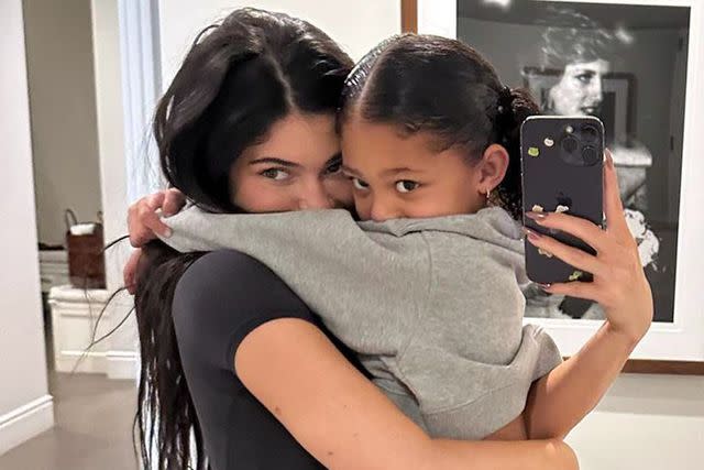<p>Kylie Jenner/Instagram</p> Kylie Jenner and daughter Stormi Webster cuddle at home