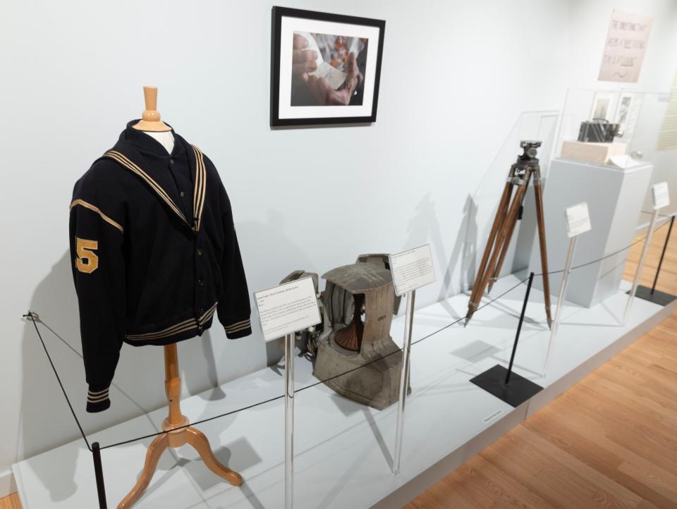 A section of the Massillon Museum's Paul Brown exhibit featuring his Great Lakes Naval Academy football coaches jacket, a football warmer and some camera gear used by his photographers to film games.