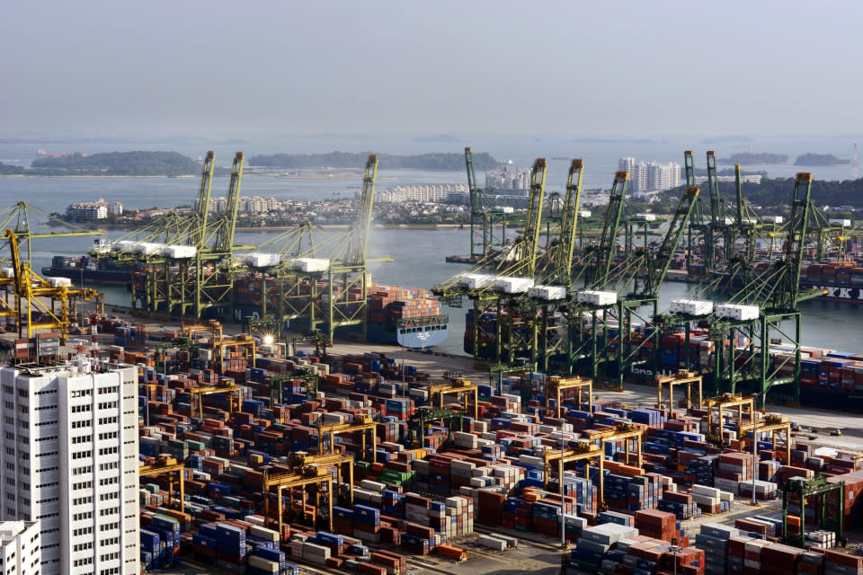 Ships sit docked while unloading freight at the Tanjong Pagar Container Terminal, in Singapore. (Photo: Getty Images)