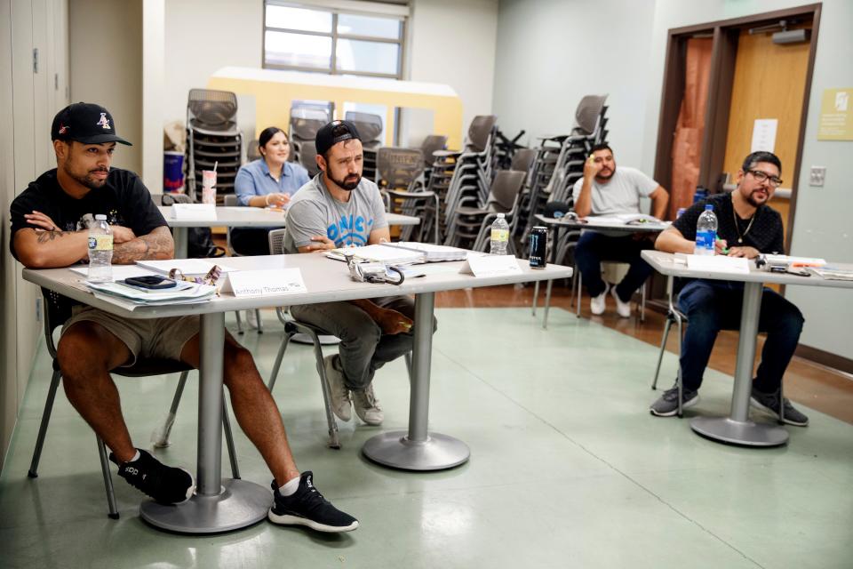 Anthony Thomas, left, Maribel Zamora, Antonio Tostado, Juan Gonzalez, and Noe Martinez train to become bus drivers for Coachella Valley Unified School District in Thermal, Calif., on July 29, 2022. 