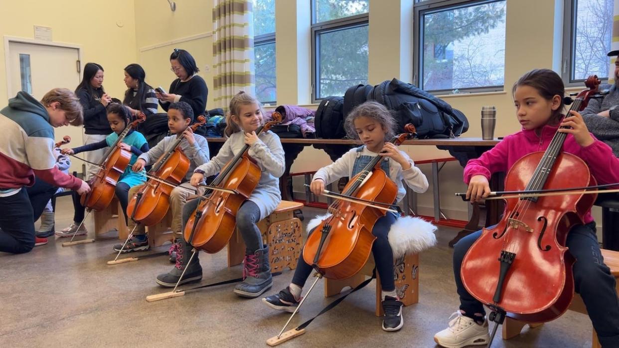 The goal of the program is to offer weekly music lessons to children who may otherwise not have had the opportunity or the means to learn how to play the cello, according to Geneviève Guimond, cellist at the Montreal Symphony Orchestra.  (Chloë Ranaldi/CBC - image credit)