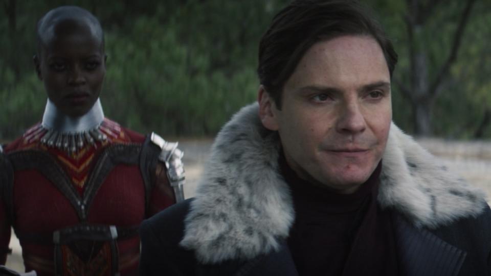 Ayo of the Dora Milaje stands behind Baron Zemo on The Falcon and the Winter Soldier