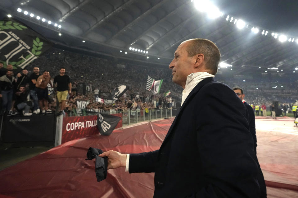 FILE - Juventus' head coach Massimiliano Allegri throws away his tie in anger as he leaves the pitch after getting a red card during the Italian Cup final soccer match between Atalanta and Juventus at Rome's Olympic Stadium, Wednesday, May 15, 2024. Juventus fired coach Massimiliano Allegri on Friday, May 17, 2024 for his ugly outburst toward the referees in the Italian Cup final. Juventus has two games left in Serie A but Allegri was due to miss them following a two-game suspension for his Cup final behavior on Wednesday. (AP Photo/Gregorio Borgia)