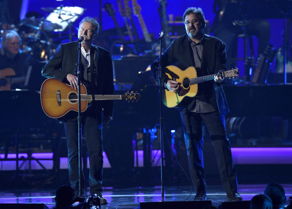 CORRECTS YEAR TO 2019 - Don Henley, left, and Vince Gill perform "Eagle When She Flies" at MusiCares Person of the Year honoring Dolly Parton on Friday, Feb. 8, 2019, at the Los Angeles Convention Center. (Photo by Chris Pizzello/Invision/AP)