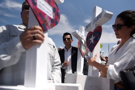 People pay their respects two days after a mass shooting in El Paso