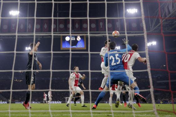 Tagliafico's header was ruled out as Courtois clattered into Tadic (Getty)