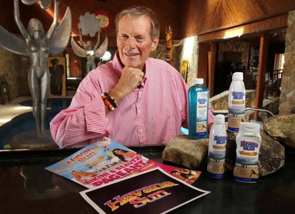 The late Hawaiian Tropic founder Ron Rice posed for a photo inside his Ormond Beach home in 2016 to promote his then-new sun care products company Havanna Sun. Dunn's Attic recently began the first of several planned online auctions of Rice's vast collection of memorabilia, one-of-a-kind items and hand-carved furniture. Bids for items in Part 1 of the auction are now accepted through  Sept. 12, 2023 at dunnsacttic.com.