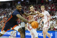 Illinois's Dain Dainja, left, and Wisconsin's Carter Gilmore (14) go after a loose ball during the first half of an NCAA college basketball game, Saturday, Jan. 28, 2023, in Madison, Wis. (AP Photo/Andy Manis)