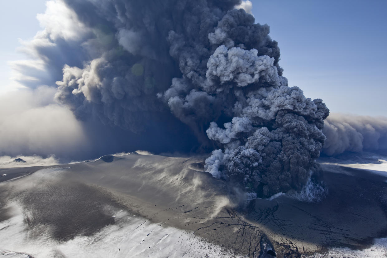 Massive ash plume erupting through 200 meter thick glacial ice sheet at the summit of Eyjafjallajokull volcano.