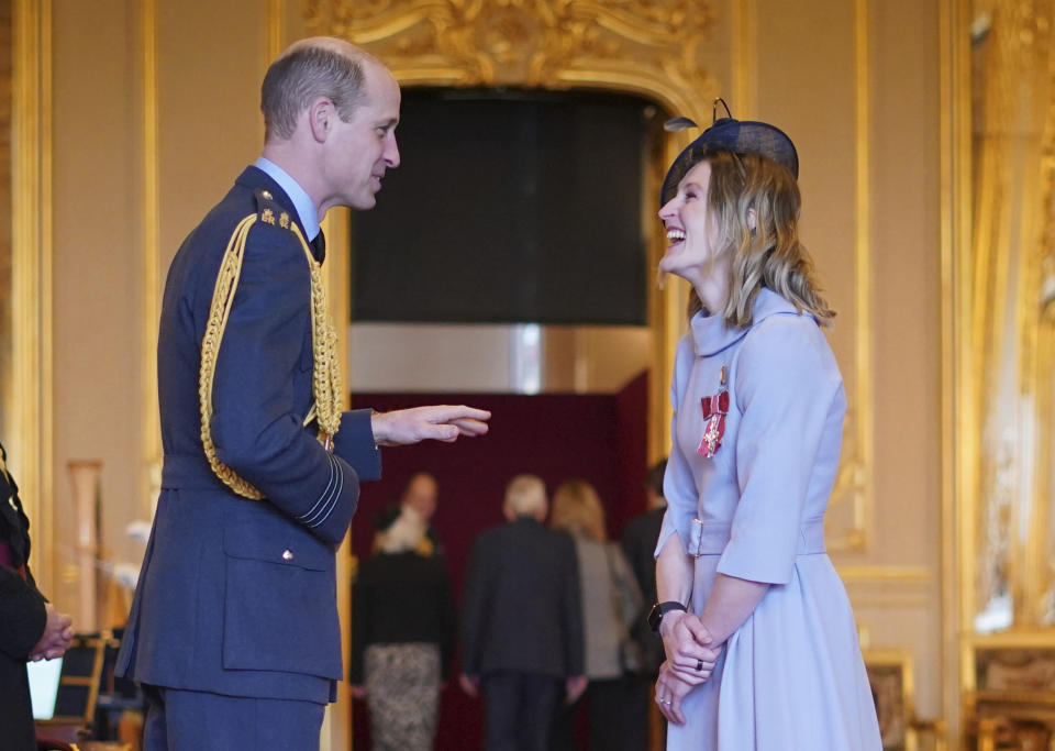 Britain's Prince William, the Prince of Wales, left, awards Mrs Ellen Convery (Ellen White), former soccer player, with the Commander of the Order of the British Empire, at Windsor Castle, Windsor, England, Wednesday, Feb. 7, 2024. (Yui Mok/PA via AP)