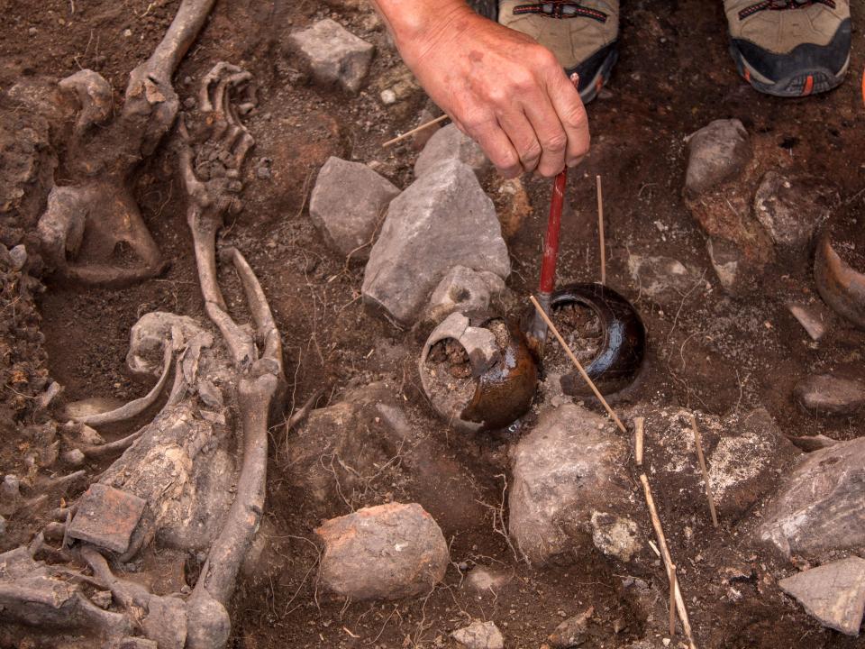 An archaeologist of the Pacopampa Archaeological Project works on the site of a 3,000-year-old tomb which they believe might have honored an elite religious leader in the Andean country some three millennia ago, in Pacopampa, Peru August 26, 2023.