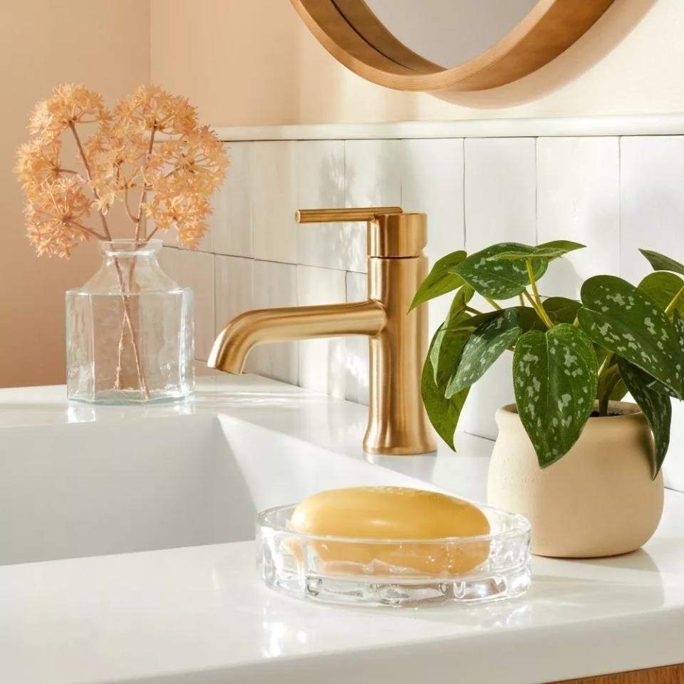 the faux plant on a bathroom sink