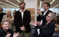 New York Times employees celebrate in New York April 20, 2015 as the newspaper wins three Pulitzer prizes in this handout photo. Daniel Berehulak, center, won the Feature Photography award. REUTERS/Ruth Fremson/The New York Times/Handout via Reuters