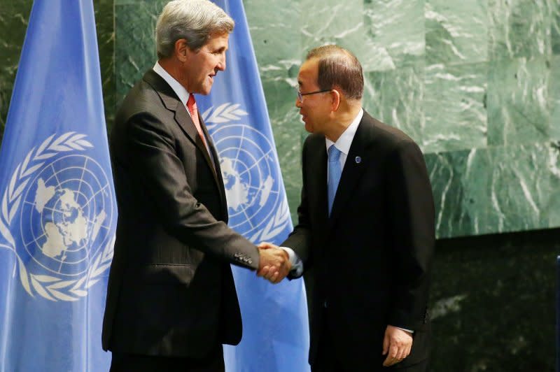 Then-U.S Secretary of State John Kerry (L) and UN Secretary-General Ban Ki-moon (R) shake hands in September 2016 to commit to the Paris Climate Agreement which set the 1.5 degrees Celsius limit on warming above pre-industrial levels. File Photo By Monika Graff/UPI