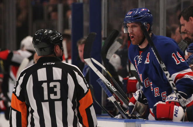 NEW YORK, NY - APRIL 26: Brad Richards #19 of the New York Rangers talks to referee Dan O'Halloran #13 in Game Seven of the Eastern Conference Quarterfinals against the Ottawa Senators during the 2012 NHL Stanley Cup Playoffs at Madison Square Garden on April 26, 2012 in New York City. (Photo by Bruce Bennett/Getty Images)