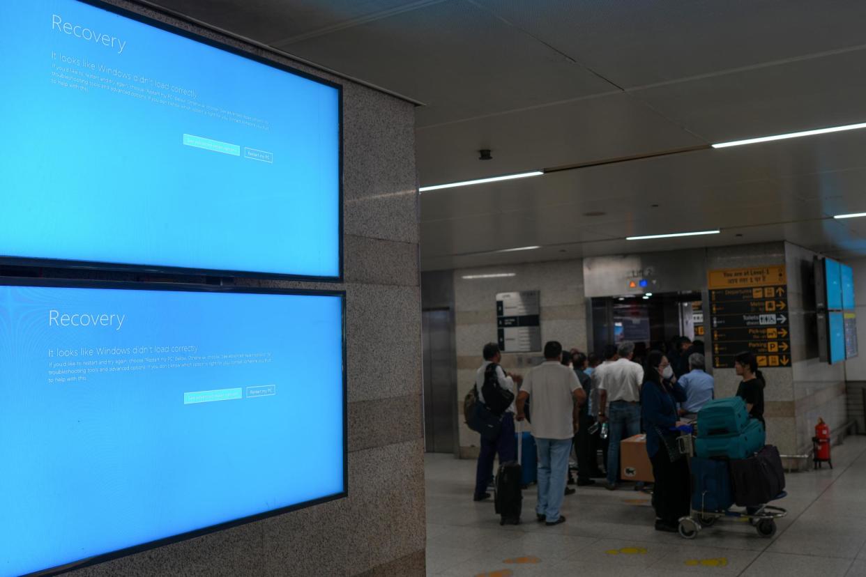 <span>Digital boards in New Delhi, India, display error messages due to the global IT outage caused by CrowdStrike on 19 July 2024.</span><span>Photograph: Anadolu/Getty Images</span>