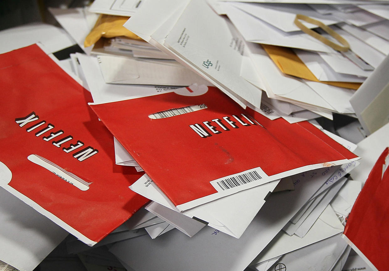 Netflix envelopes sit in a bin of mail at the U.S. Post Office sort center in San Francisco in 2010. (Justin Sullivan/Getty Images)