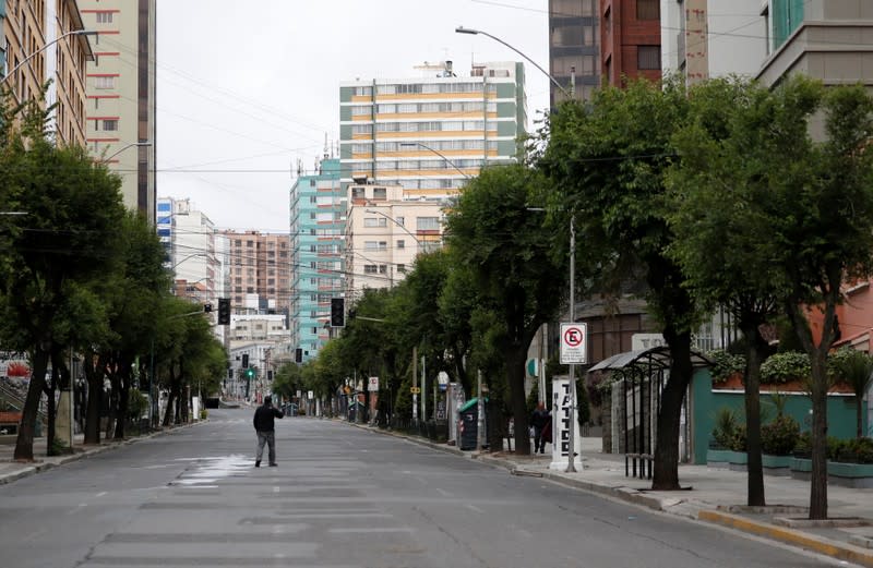 A man walks on an empty street in La Paz