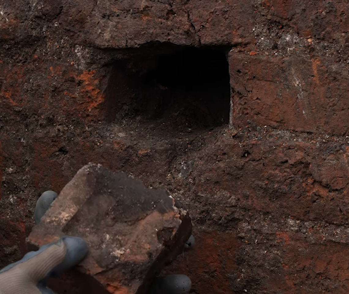 One brick in the cellar was cut out, and a small hole was present in the back where something could be hidden, archaeologists said.