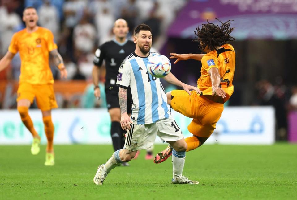 Messi in action against Netherlands defender Nathan Ake (Reuters)
