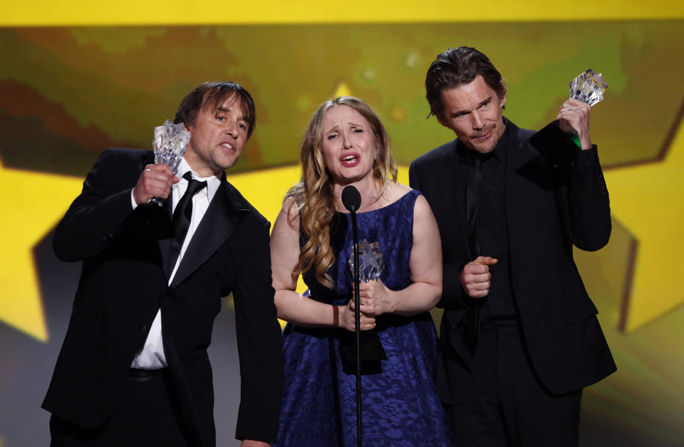 Actress and writer Julie Delpy accepts the Louis XIII Genius Award along with director and writer Richard Linklater (L) and actor Ethan Hawke at the 19th annual Critics' Choice Movie Awards in Santa Monica, California January 16, 2014.  REUTERS/Mario Anzuoni   (UNITED STATES Tags: ENTERTAINMENT)(CRITICSCHOICE-SHOW)