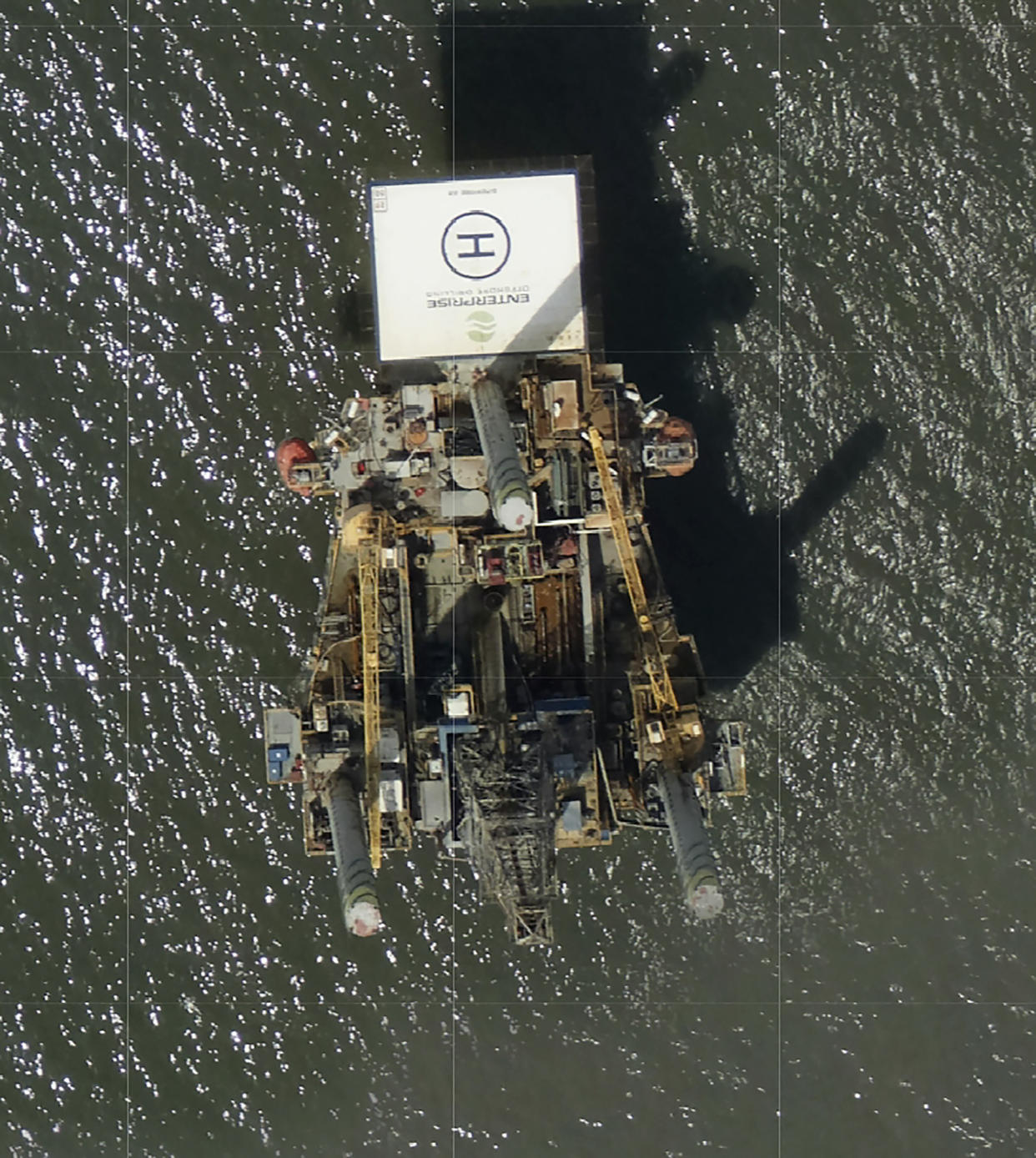 Photos captured by National Oceanic and Atmospheric Administration aircraft Tuesday, Aug. 31, 2021 and reviewed by The Associated Press a large rig marked with the name Enterprise Offshore Drilling is seen. (NOAA via AP)