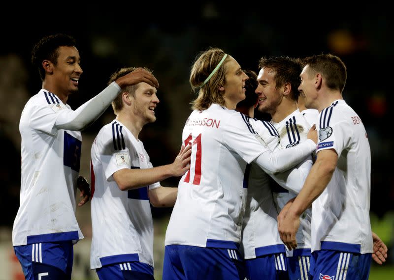 FILE PHOTO: Faroe Islands players celebrate a goal against Latvia in a 2018 World Cup qualifying match