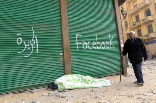 An Egyptian anti-government demonstrator sleeps on the pavement under spray paint that reads "Al-Jazeera" and "Facebook" at Cairo's Tahrir Square in February 2011 on the 14th day of protests calling for the ouster of President Hosni Mubarak. Six months after they launched a revolution that ousted the regime, Egyptian bloggers acknowledged that it takes more than Facebook to overthrow a dictator