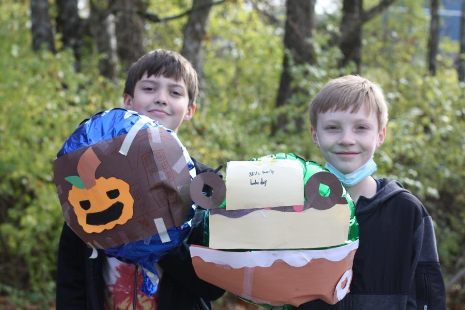 Oliver Conner with his Halloween themed balloon with classmate Nathan Mills representing his family’s tradition of baking at Balloons over Shannondale at Shannondale Elementary on Nov. 23, 2021.