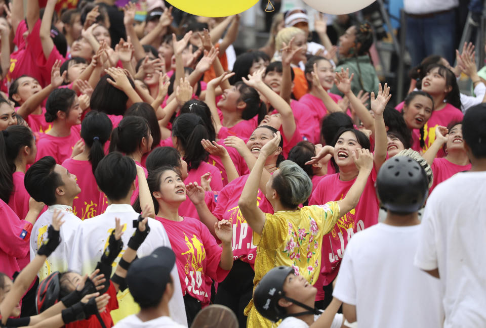 Dancers cheer during the National Day celebrations in Taipei, Taiwan, Saturday, Oct. 10, 2020. The National Day dates from the start of a 1911 rebellion against the Qing, China's last empire, that led to the establishment of the Republic of China, which remains Taiwan's formal name. (AP Photo/Chiang Ying-ying)