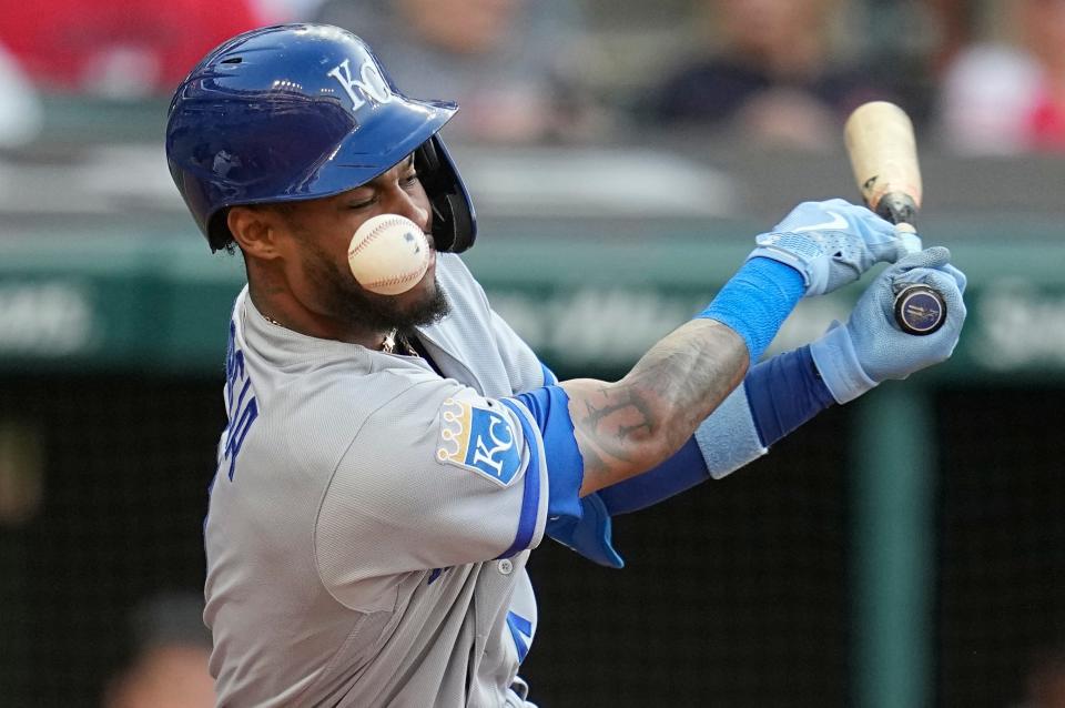 Kansas City Royals' Maikel Garcia is hit on the face by a foul tip during the fourth inning of the team's baseball game against the Cleveland Guardians on Friday, July 7, 2023, in Cleveland. (AP Photo/Sue Ogrocki)