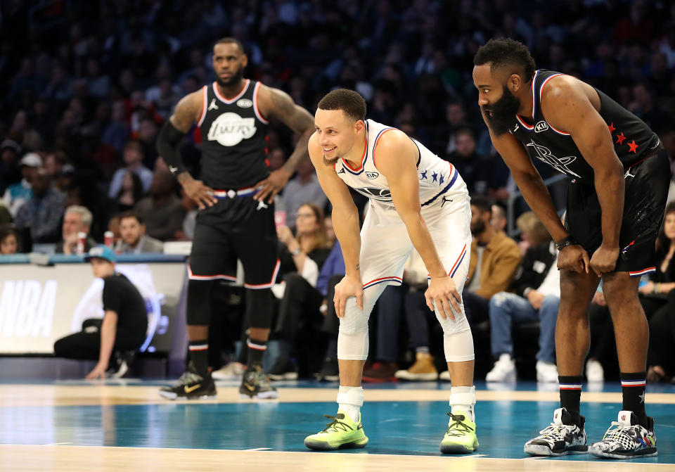 Stephen Curry smiles alongside James Harden during the third quarter of the All-Star Game on Sunday. (Photo by Streeter Lecka/Getty Images)