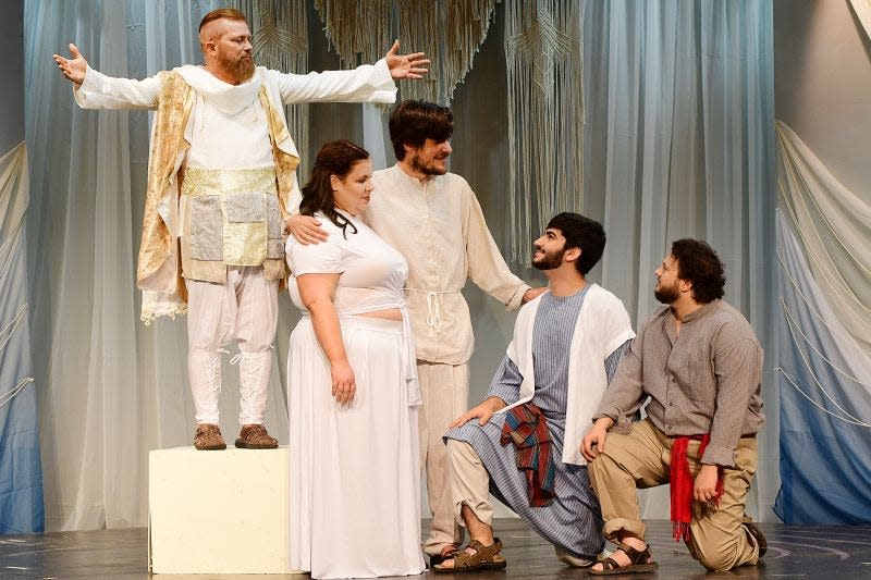 Father (Gary Patterson) (left) with his family (left to right): Eve (Andrea Cary), Adam (Travis Myers-Arrigoni), Abel (Mark VanHorn) and Cain (J. Daniel Craig) appear in Red Barn Players production of "Children of Eden."