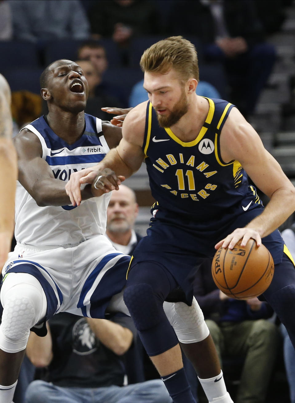 Indiana Pacers' Domantas Sabonis, right, of Lithuania, drives around Minnesota Timberwolves' Gorgui Dieng of Senegal in the first half of an NBA basketball game Wednesday, Jan. 15, 2020, in Minneapolis. (AP Photo/Jim Mone)