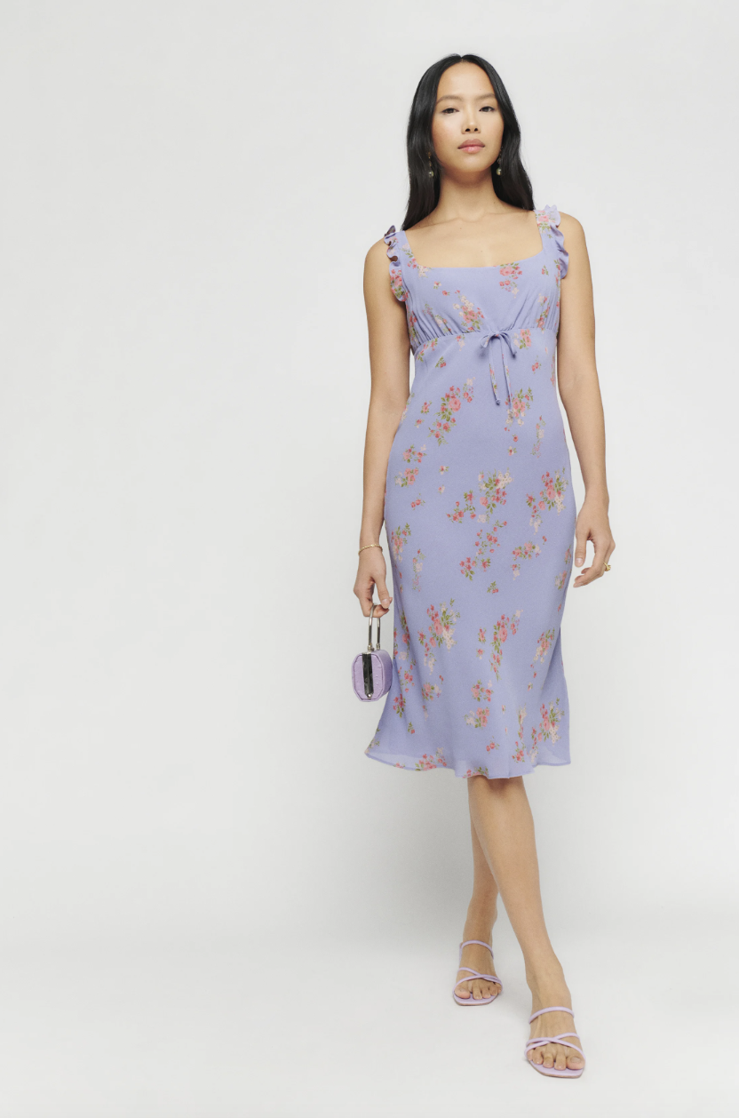 model in light purple floral midi dress, Leni Dress (Photo via Reformation)