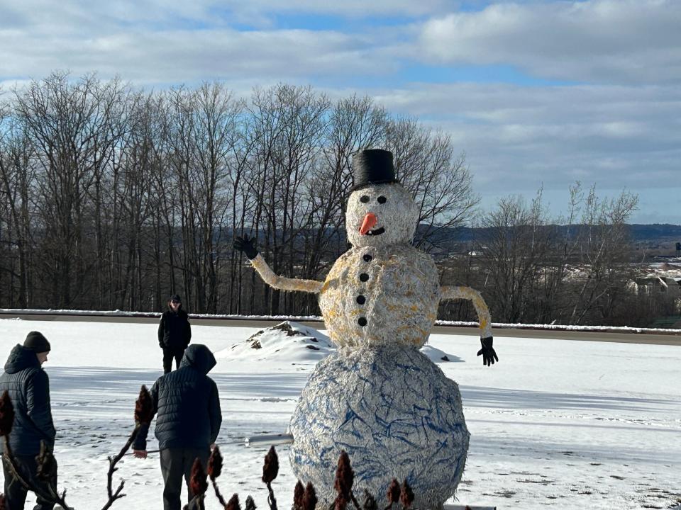 The giant paper snowman is set alight by a participating LSSU hockey player during the annual Snowman Burning on March 21, 2024.