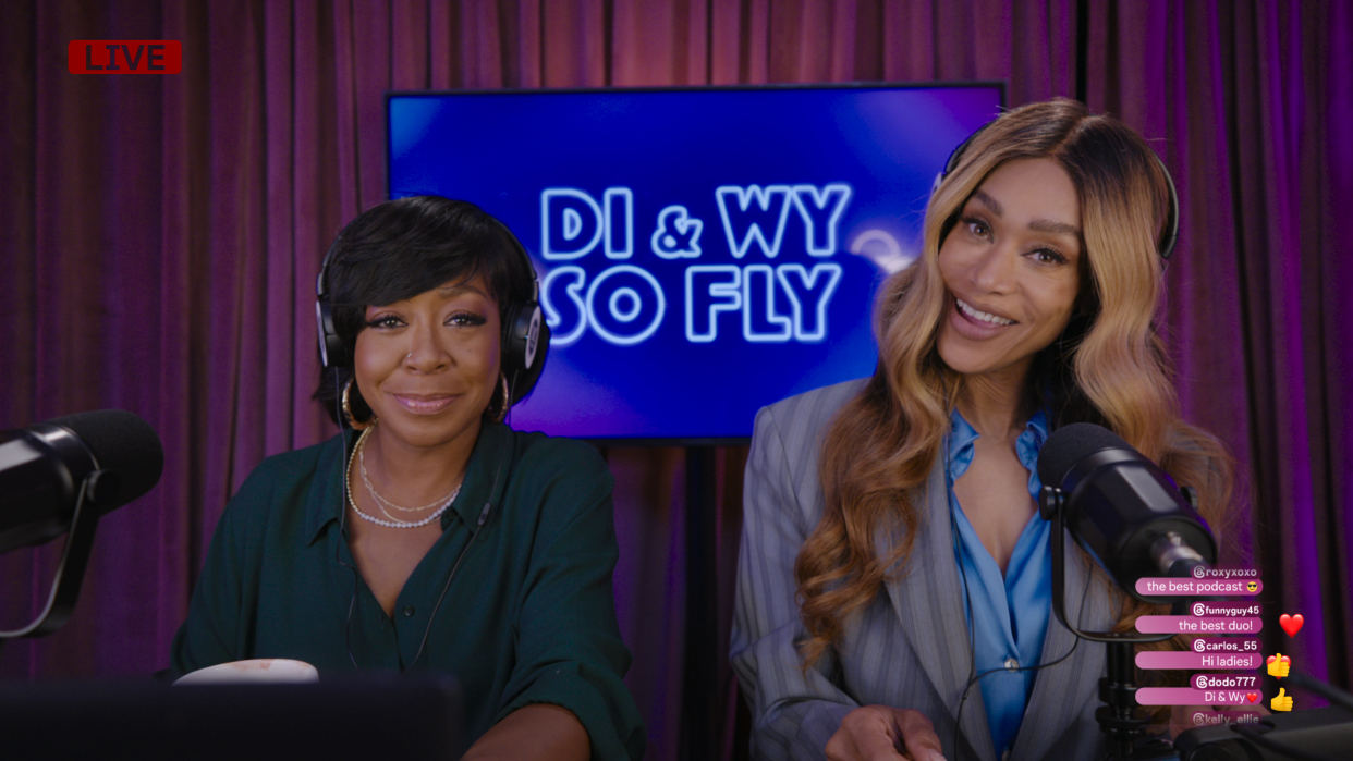  Tichina Arnold and Tami Roman as Wyvetta and Dione with headphones in So Fly Christmas. 