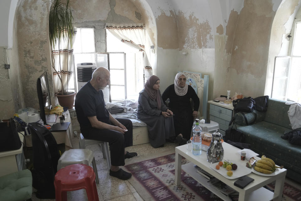 FILE - Nora, right, and Mustafa Ghaith-Sub Labans, seen in their home in the Muslim Quarter of the Old City of Jerusalem, Thursday, June 15, 2023. The family has battled Israeli attempts to force them out for the past 45 years. The campaign ended this spring, when the Israeli Supreme Court struck down their final appeal in favor of Jewish settlers contending they violated the lease. Now, Israeli authorities have ordered the eviction of the family to take place by July 13. (AP Photo/Mahmoud Illean, File)