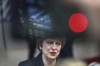 British Prime Minister Theresa May speaks with the media as she arrives for an EU summit in Brussels, Thursday, Dec. 13, 2018. EU leaders gather for a two-day summit, beginning Thursday, which will center on the Brexit negotiations. (AP Photo/Francisco Seco)